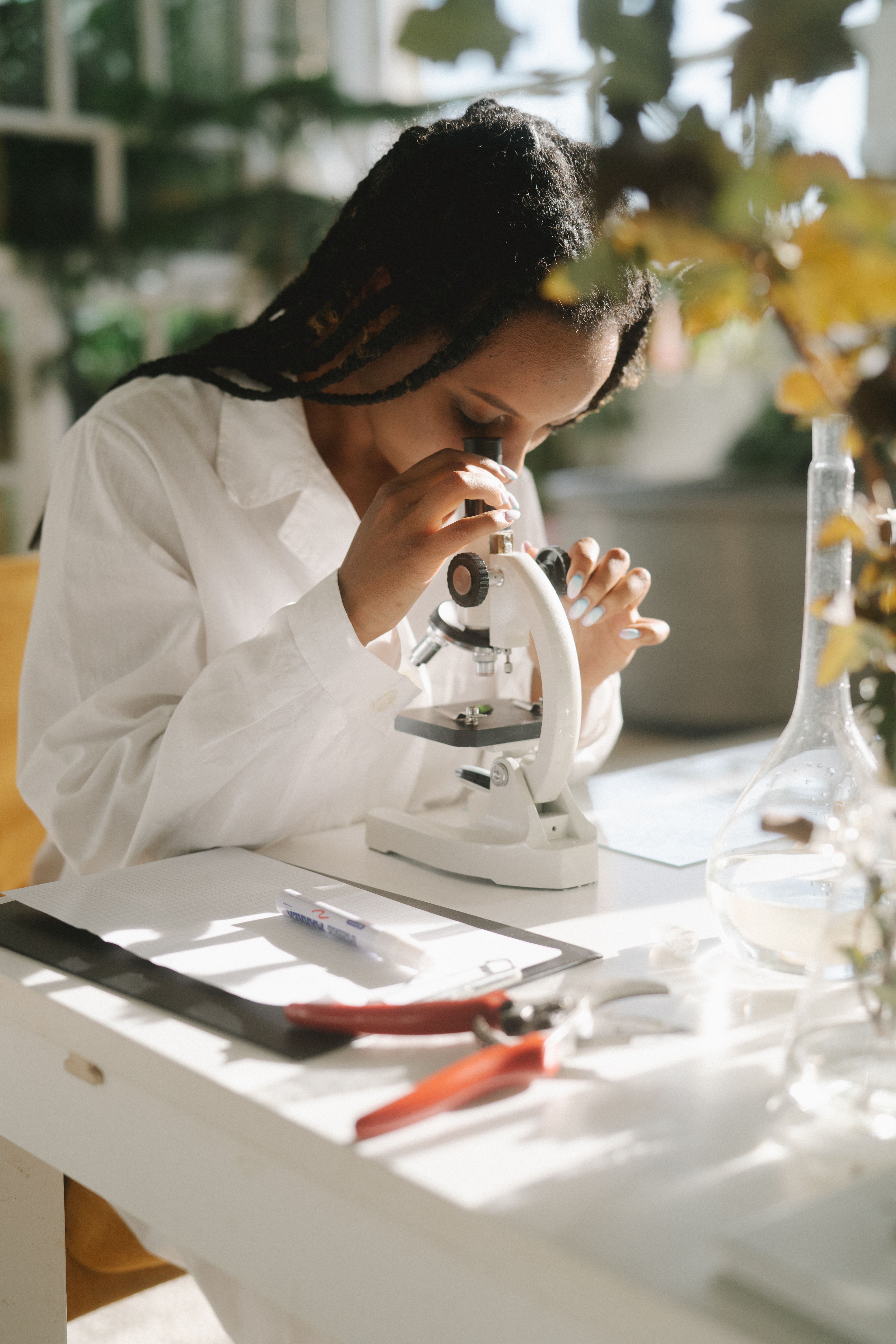 Biology student at a microscope